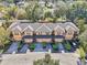 Aerial view of townhomes with attached garages and neatly landscaped front yards at 2020 Retreat View Cir, Sanford, FL 32771