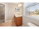 Double sink bathroom with large mirror and window at 2020 Retreat View Cir, Sanford, FL 32771