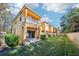 Townhome exterior with patio and grill at 2020 Retreat View Cir, Sanford, FL 32771