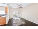 Bright living room with dark hardwood floors, a ceiling fan, and access to a patio at 2020 Retreat View Cir, Sanford, FL 32771