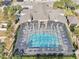 Community pool with screened enclosure and lounge chairs at 2020 Retreat View Cir, Sanford, FL 32771