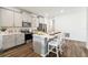 Modern kitchen with gray cabinets, an island, and stainless steel appliances at 2615 Kinsale Ln, Ormond Beach, FL 32174