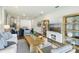 Spacious living area featuring built-in shelving and a large TV at 2615 Kinsale Ln, Ormond Beach, FL 32174