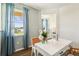 Home office featuring a white desk, large window, and stylish decor at 2615 Kinsale Ln, Ormond Beach, FL 32174