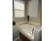 Relaxing bathroom with soaking tub and window at 10198 Oak Crest Rd, Orlando, FL 32829