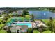 Aerial view of community pool, spa, and lake at 10198 Oak Crest Rd, Orlando, FL 32829