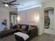 Spacious living room with a sectional sofa and large TV at 10198 Oak Crest Rd, Orlando, FL 32829