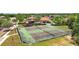Aerial view of two tennis courts near residential homes at 10198 Oak Crest Rd, Orlando, FL 32829