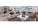 Spacious living room with white sofas and marble-look coffee table at 1304 Hanoverian Dr, Lake Alfred, FL 33850