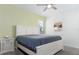 Spacious bedroom with a ceiling fan and large window at 1593 Mulligan Blvd, Davenport, FL 33896