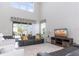 Open living room with high ceilings and a view of the backyard at 1593 Mulligan Blvd, Davenport, FL 33896