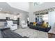 Open living room with high ceilings, a large sectional sofa, and a view of the pool at 1593 Mulligan Blvd, Davenport, FL 33896
