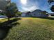 Ranch-style home with mature landscaping and a two-car garage at 2862 Charing Cross Way, Orlando, FL 32837