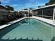 Inviting kidney-shaped pool with a screened enclosure and pergola at 2862 Charing Cross Way, Orlando, FL 32837