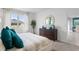 Spacious main bedroom with king-size bed and dresser at 308 Corso Loop, Winter Haven, FL 33884