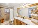 Updated bathroom with walk-in shower, tiled walls, and modern vanity at 3420 Lake Harney Cir, Geneva, FL 32732