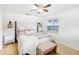 Main bedroom with a king-size bed, stylish decor and wood floors at 3420 Lake Harney Cir, Geneva, FL 32732