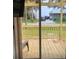 Back deck overlooks a waterfront view with trees and houses at 3420 Lake Harney Cir, Geneva, FL 32732