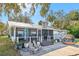 Home with a screened porch and patio area at 3420 Lake Harney Cir, Geneva, FL 32732