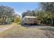 Quaint guest house with a pergola-covered deck at 3420 Lake Harney Cir, Geneva, FL 32732