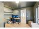 L-shaped home office with built-in shelving and hardwood floors at 3420 Lake Harney Cir, Geneva, FL 32732