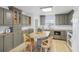Modern kitchen with gray cabinets, an island, and light wood floors at 3420 Lake Harney Cir, Geneva, FL 32732