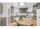 Updated kitchen boasts gray cabinets, a large island, and stainless steel appliances at 3420 Lake Harney Cir, Geneva, FL 32732