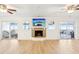Spacious living area featuring hardwood floors, fireplace, and stunning water views at 3420 Lake Harney Cir, Geneva, FL 32732