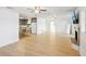 Open living room with hardwood floors, fireplace and kitchen views at 3420 Lake Harney Cir, Geneva, FL 32732