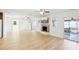Open living room with hardwood floors, fireplace and access to a deck at 3420 Lake Harney Cir, Geneva, FL 32732