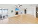 Open living room with hardwood floors, fireplace and water views at 3420 Lake Harney Cir, Geneva, FL 32732