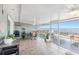 Spacious screened porch overlooking the water with seating and a grill at 3420 Lake Harney Cir, Geneva, FL 32732