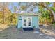 Detached storage shed with double doors at 3420 Lake Harney Cir, Geneva, FL 32732