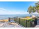 Scenic waterfront view with a fenced yard at 3420 Lake Harney Cir, Geneva, FL 32732