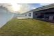 Spacious backyard with large grassy area and pool at 402 Blue Lake Cir, Kissimmee, FL 34758