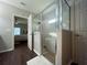 Clean bathroom with a walk-in shower and a soaking tub at 402 Blue Lake Cir, Kissimmee, FL 34758