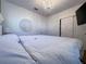 Primary bedroom with king-size bed and walk-in closet at 402 Blue Lake Cir, Kissimmee, FL 34758