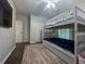 Bedroom with bunk beds, a dresser, and a closet at 402 Blue Lake Cir, Kissimmee, FL 34758