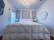 Primary bedroom featuring a king bed and elegant decor at 402 Blue Lake Cir, Kissimmee, FL 34758