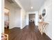 Bright and spacious entryway with dark hardwood floors and modern console table at 402 Blue Lake Cir, Kissimmee, FL 34758