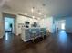 Open concept kitchen boasting white cabinets and a breakfast bar at 402 Blue Lake Cir, Kissimmee, FL 34758