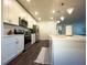 Clean kitchen with white cabinets, stainless steel appliances, and an island at 402 Blue Lake Cir, Kissimmee, FL 34758