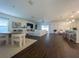 Open living room and kitchen with dark hardwood floors at 402 Blue Lake Cir, Kissimmee, FL 34758