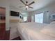 Bright bedroom with a large bed and built-in media shelving at 402 Blue Lake Cir, Kissimmee, FL 34758