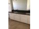 Bathroom with double vanity and granite countertops at 413 Summit Ridge Pl # 305, Longwood, FL 32779