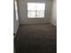 Spacious bedroom with neutral carpeting and large window at 413 Summit Ridge Pl # 305, Longwood, FL 32779