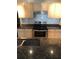 Modern kitchen with stainless steel appliances and granite countertops at 413 Summit Ridge Pl # 305, Longwood, FL 32779