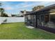 Screened patio and grassy backyard with privacy fence at 553 Whittingham Pl, Lake Mary, FL 32746