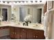 Double vanity bathroom with updated cabinets and a large mirror at 553 Whittingham Pl, Lake Mary, FL 32746