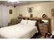 Cozy bedroom with a queen-size bed and wooden furniture at 553 Whittingham Pl, Lake Mary, FL 32746